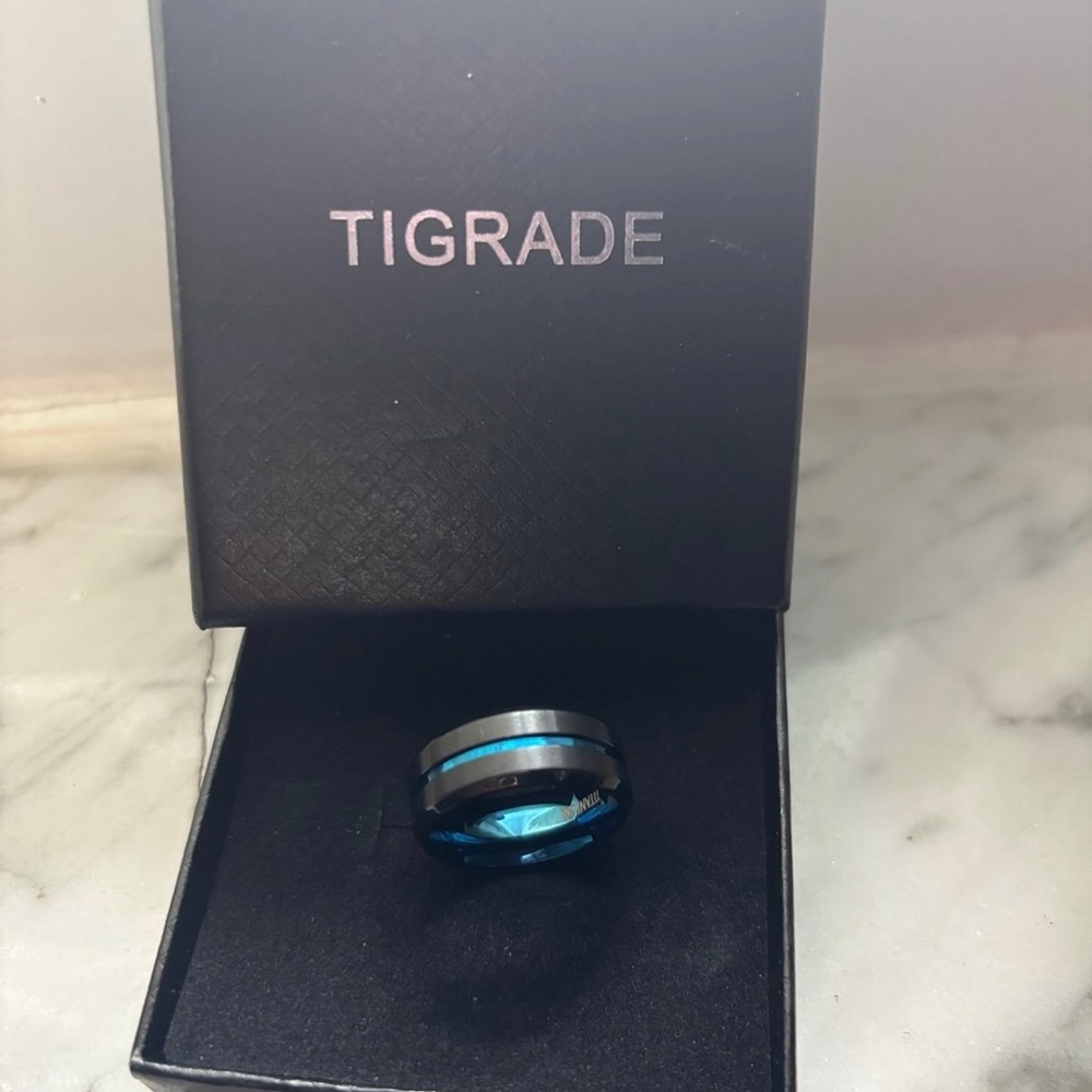 (NWOT) TIGRADE Titanium Blue
Tungsten Ring 8mm (size 8)